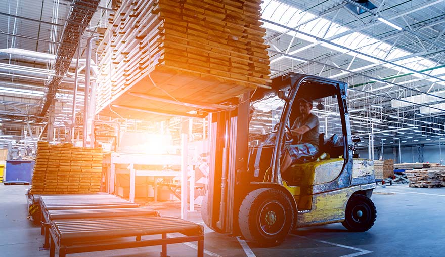 Smith Machine Worx - Forklift carrying stacks of wood